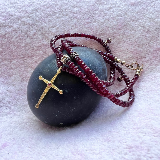 delicate ruby necklace with gold cross